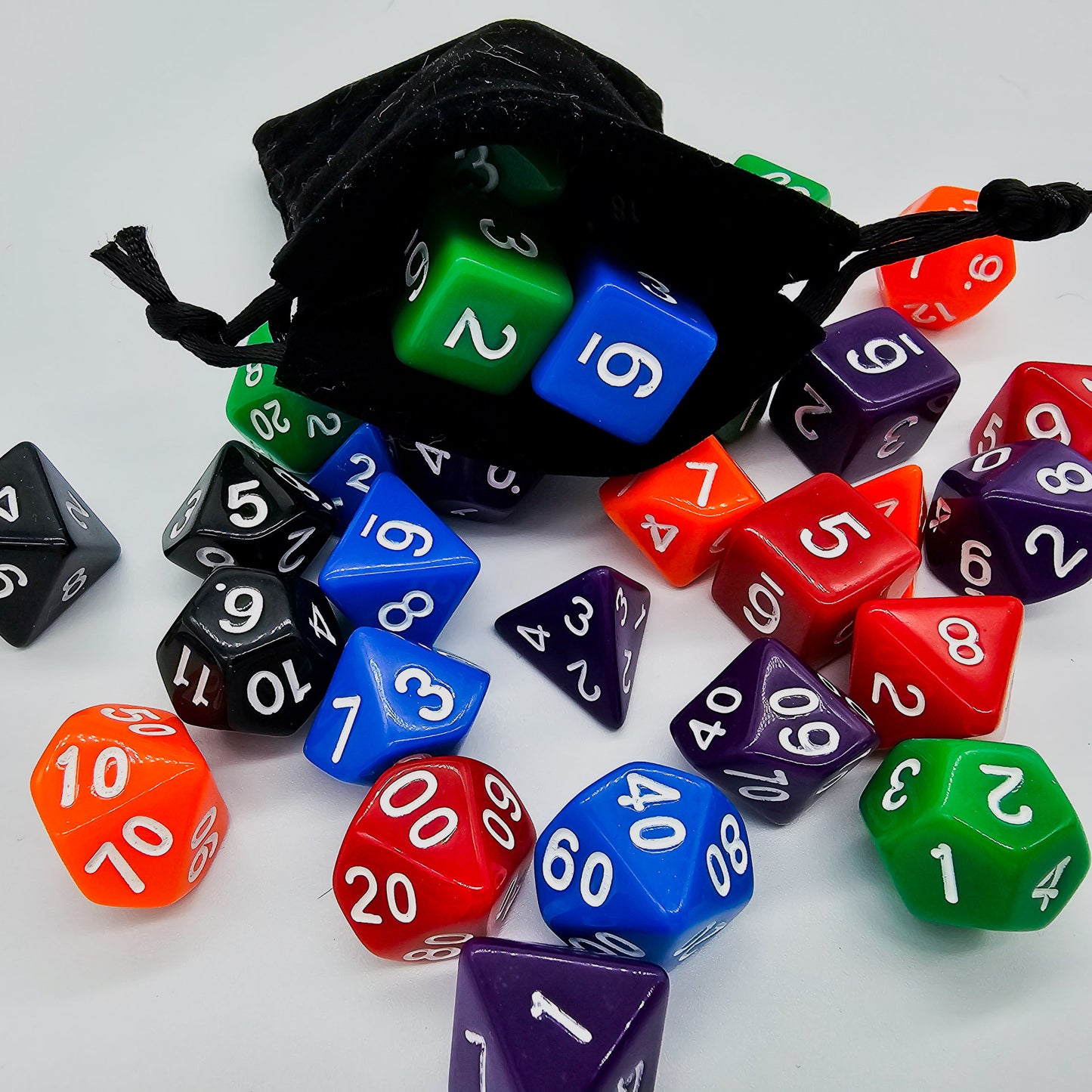 42 piece resin dnd dice set for 6 dungeon and dragons players. The dice colors are green, blue, red, purple, orange and black.