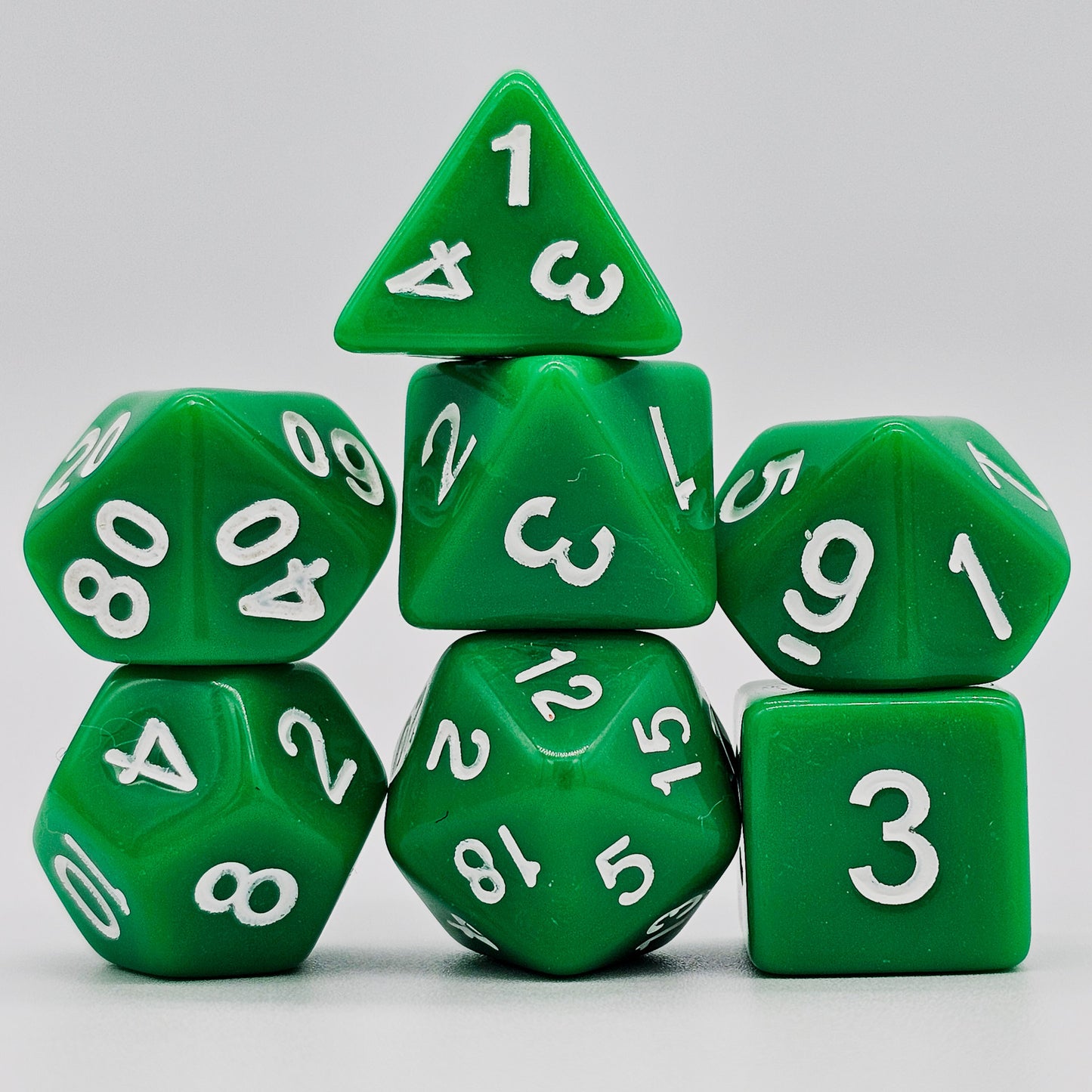 42 piece resin dnd dice set for 6 dungeon and dragons players. The dice colors are green, blue, red, purple, orange and black.