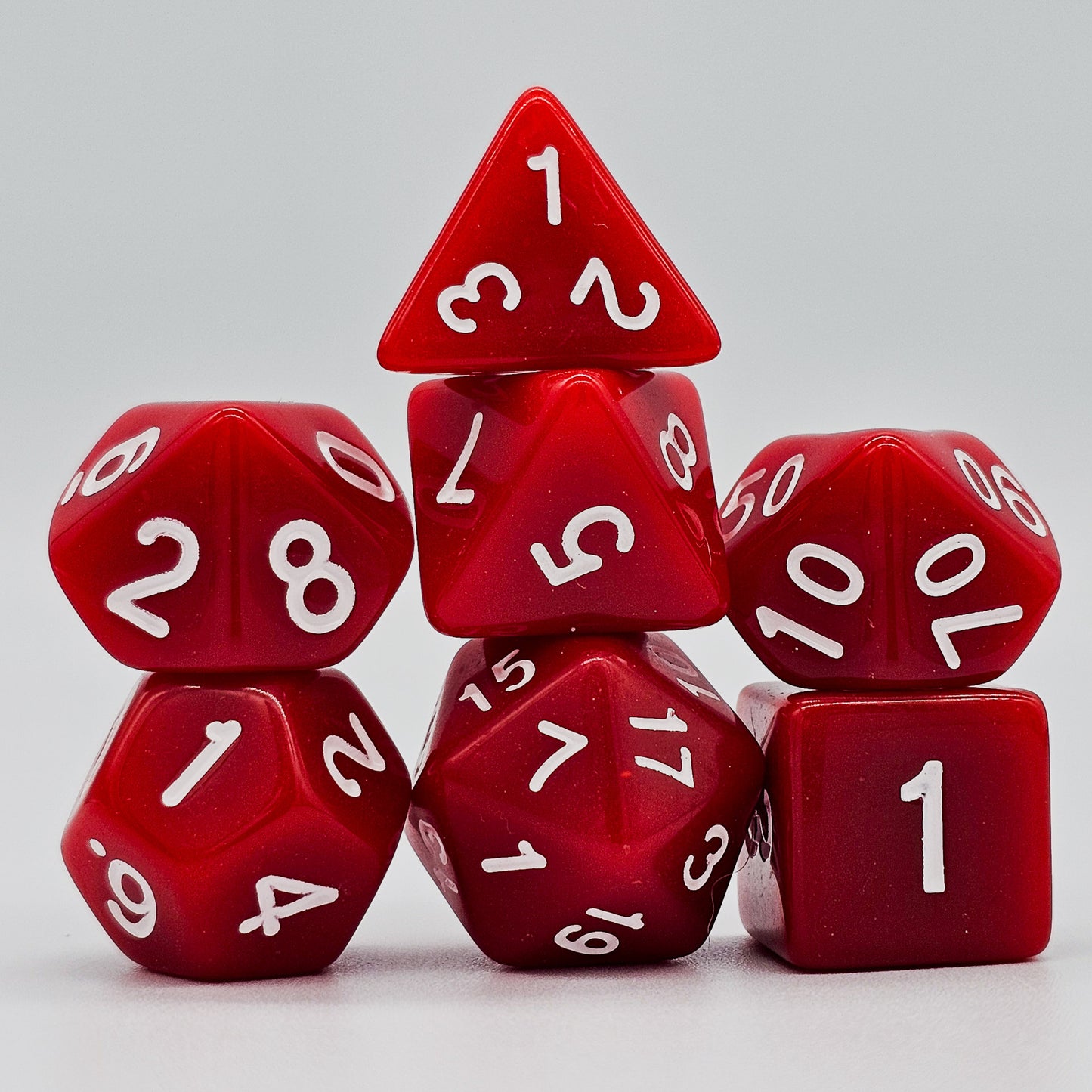 42 piece resin dnd dice set for 6 dungeon and dragons players. The dice colors are green, blue, red, purple, orange and black.
