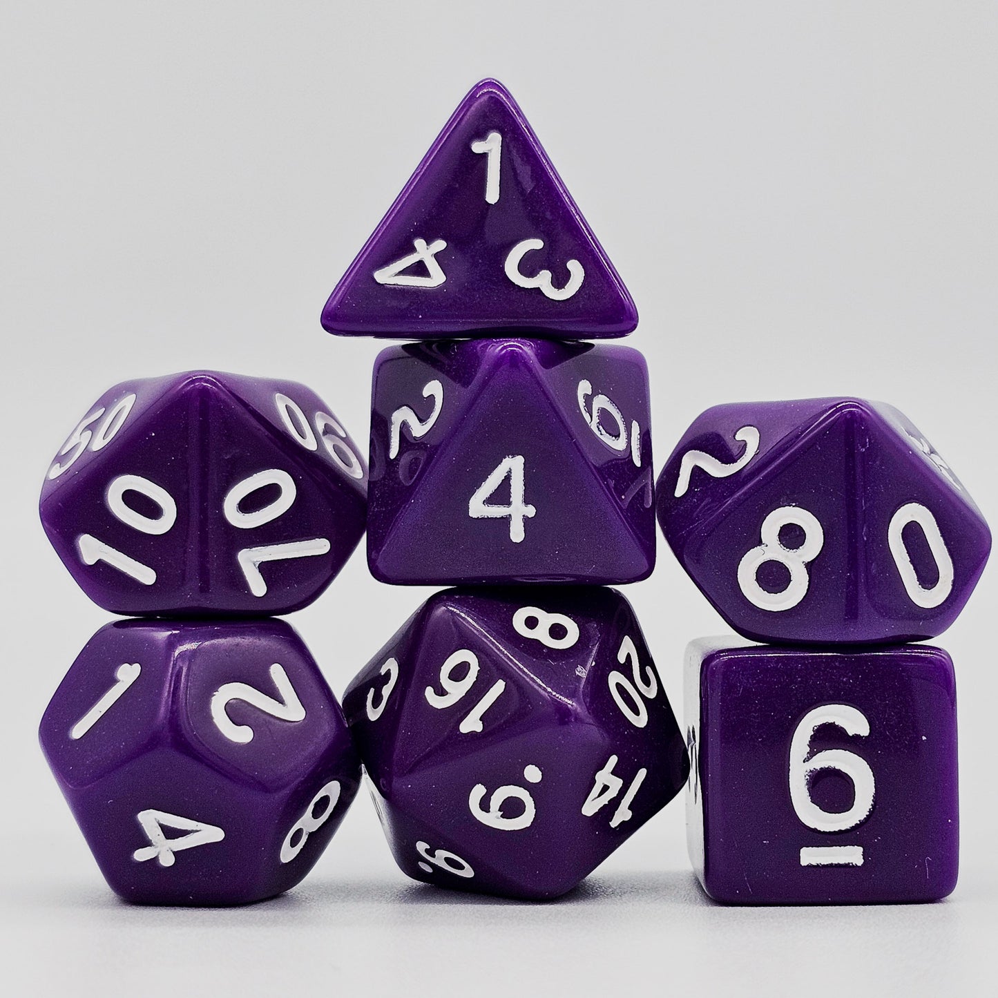 42 piece resin dnd dice set for 6 dungeon and dragons players. The dice colors are green, blue, red, purple, orange and black.