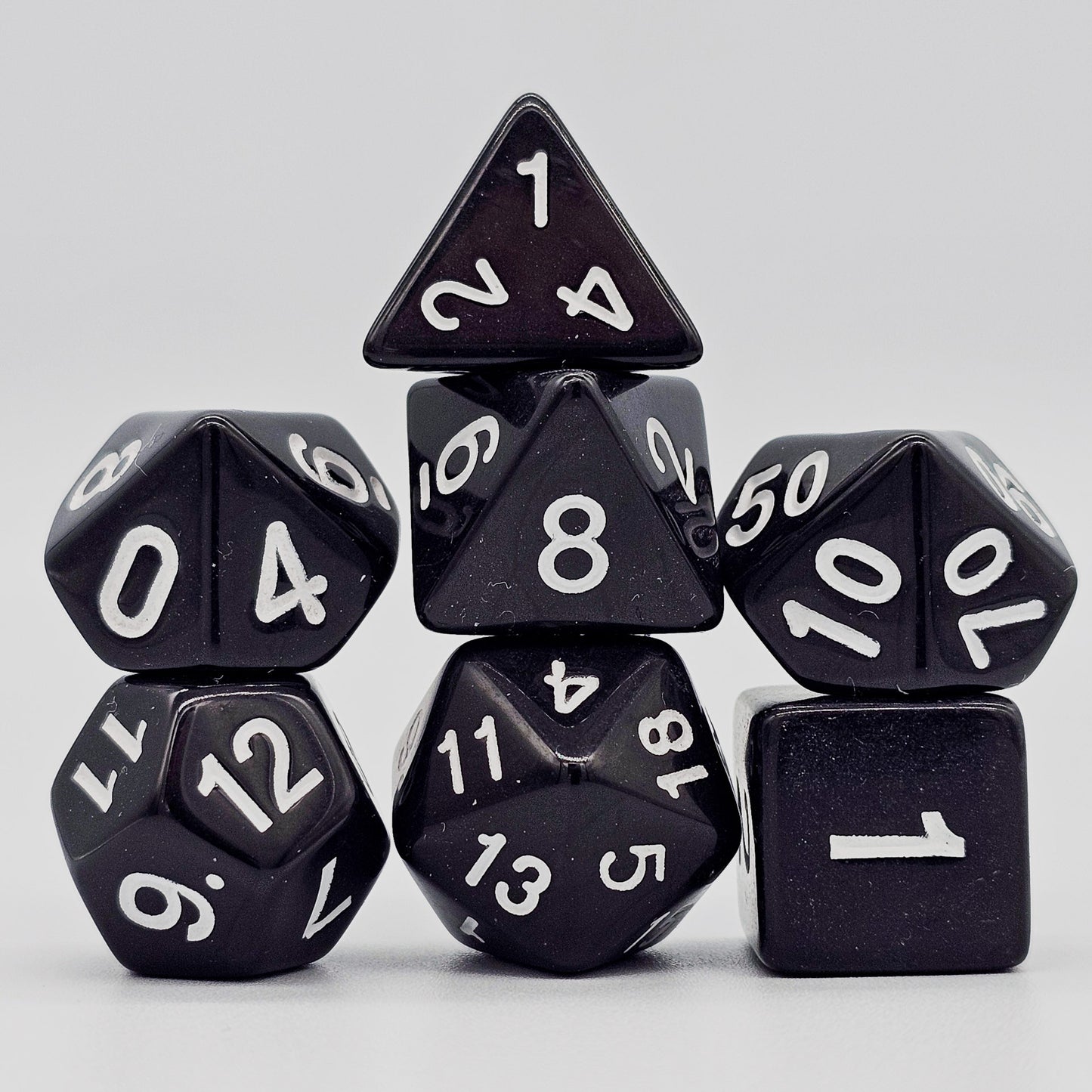 42 piece resin dnd dice set for 6 dungeon and dragons players. The dice colors are green, blue, red, purple, orange and black.