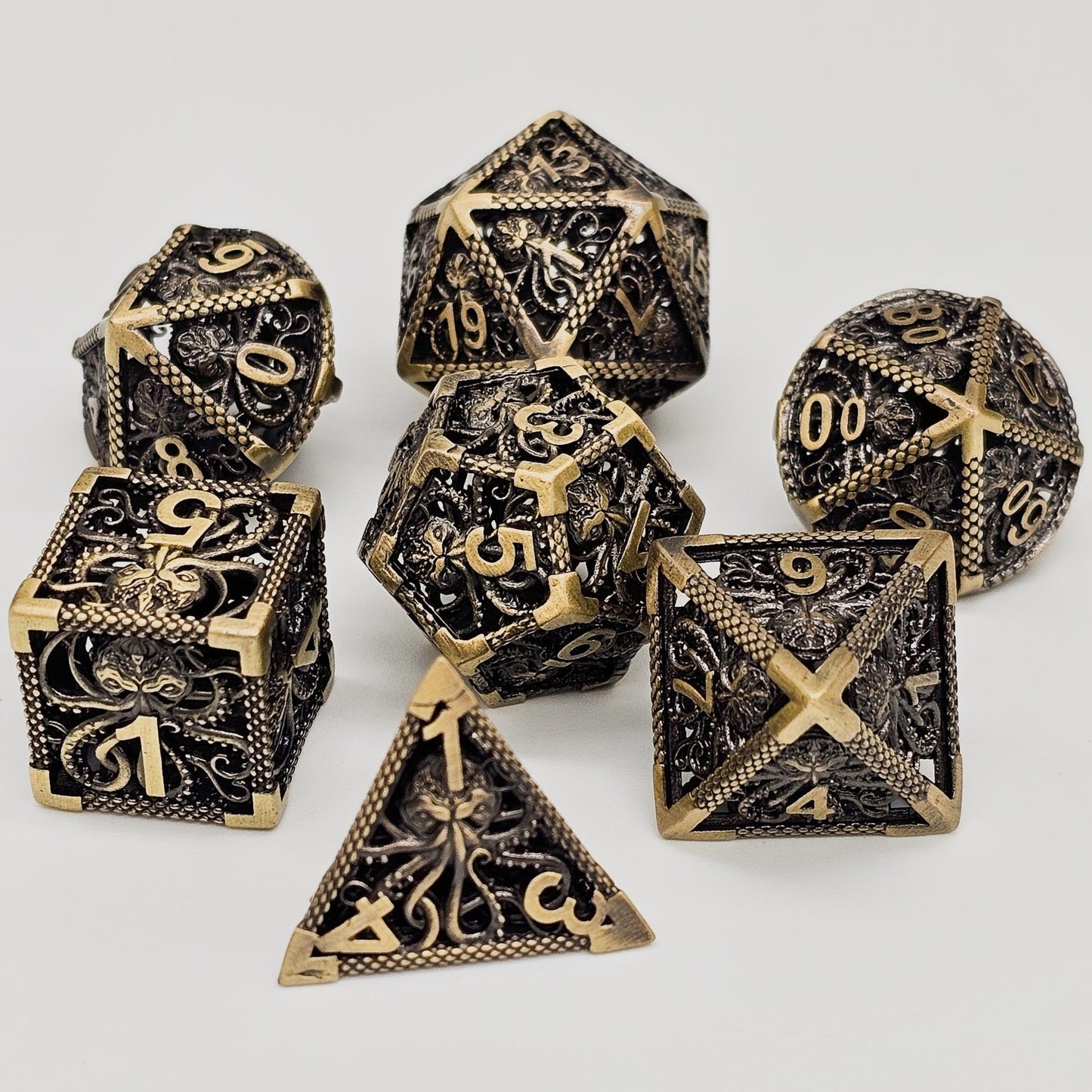 Ancient Gold Hollow Metal Cthulhu DND Dice Set