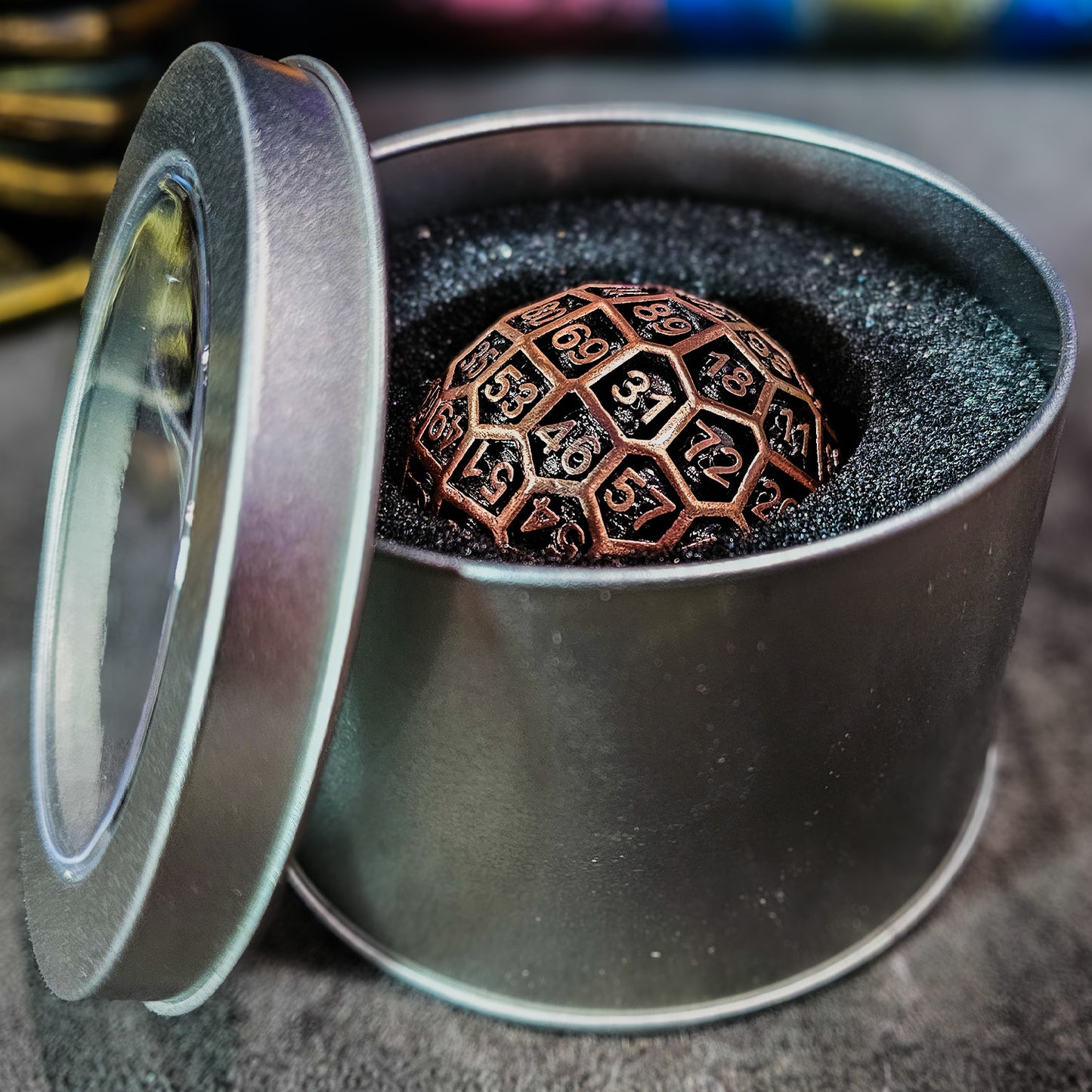 Red Copper Hollow Metal D100 DND Dice inside a silver metal spherical container with a plastic see through lid.