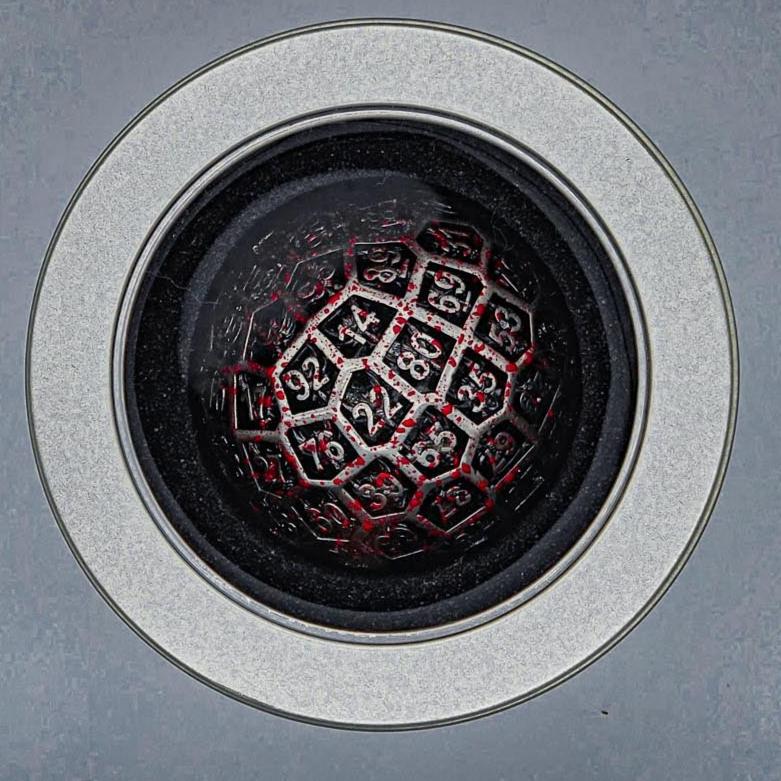 top down view of a Hollow Metal Silver Blood D100 DND Dice inside a round silver metal container with a plastic see through lid revealing the D100 Die inside.