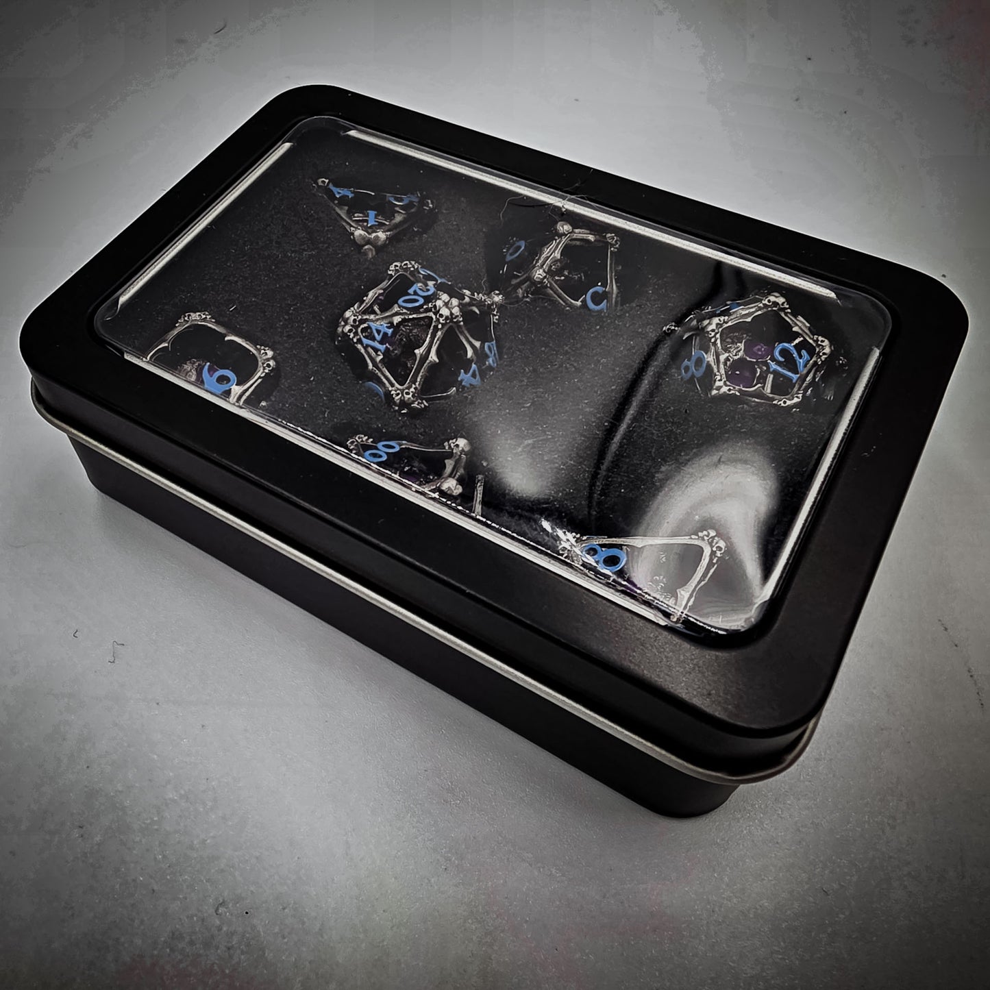 Silver & Blue Hollow Metal 3D Skull DND Dice Set