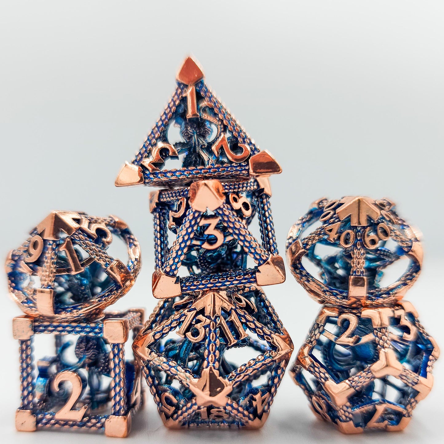 Blue & Rose Gold Hollow Metal Cthulhu Dice