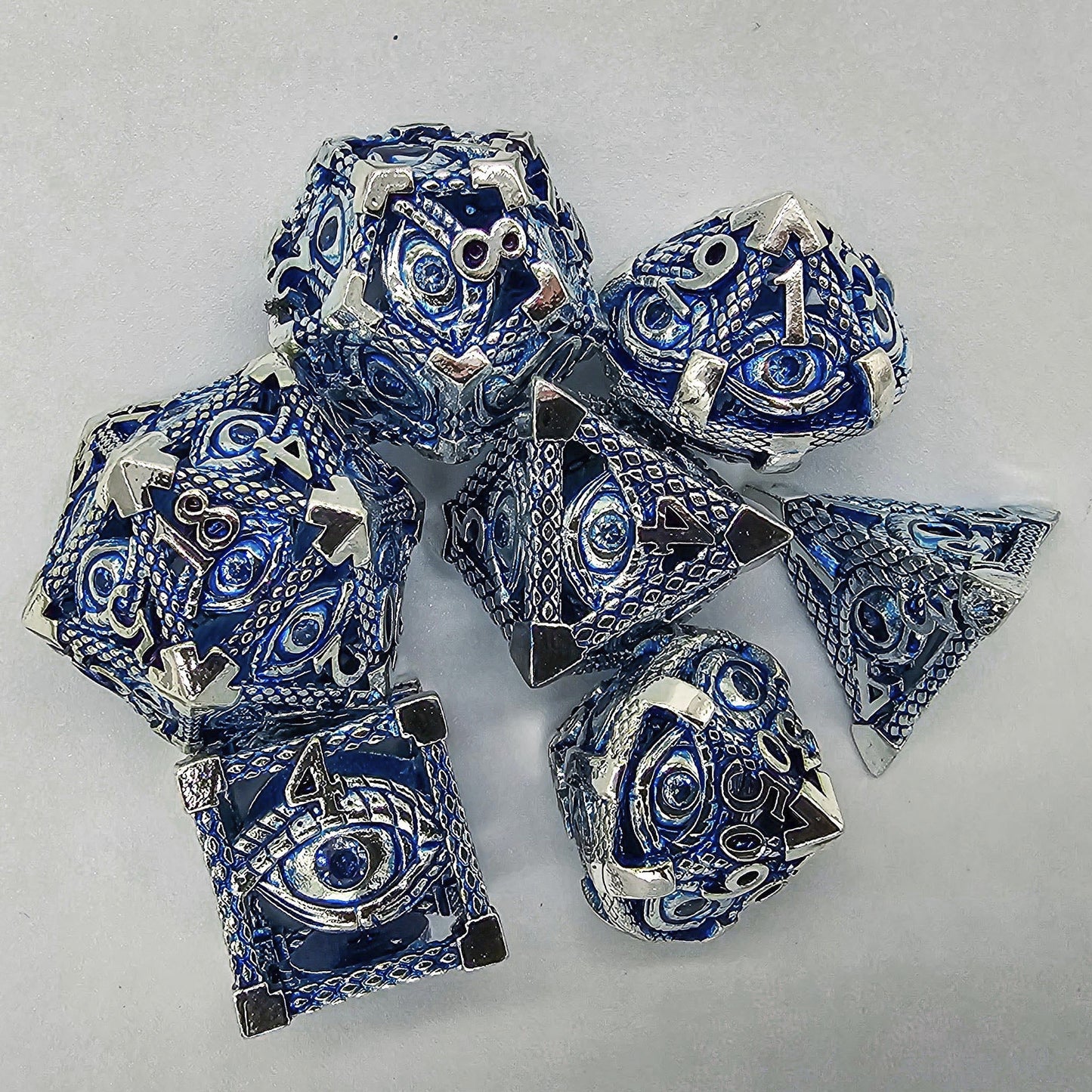 Blue & Silver Hollow Metal Illuminati Dice