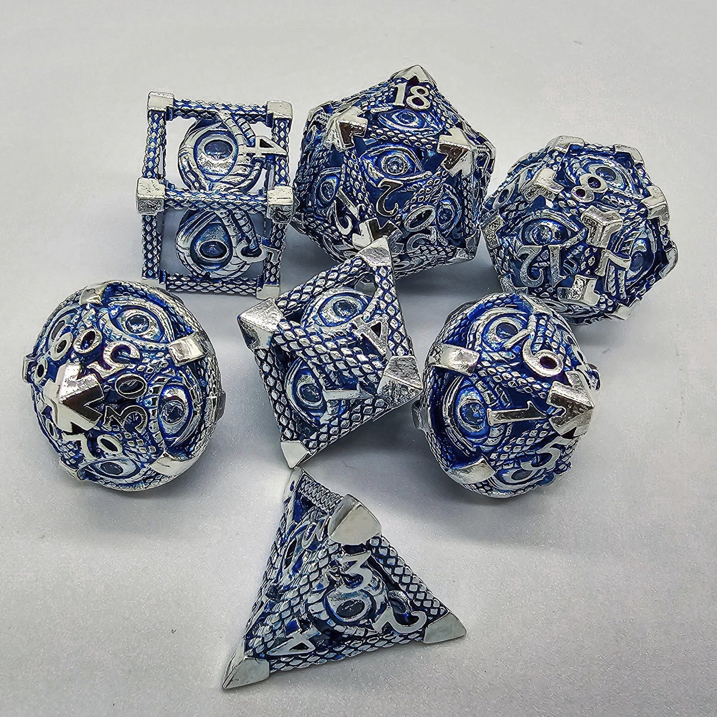 Blue & Silver Hollow Metal Illuminati Dice