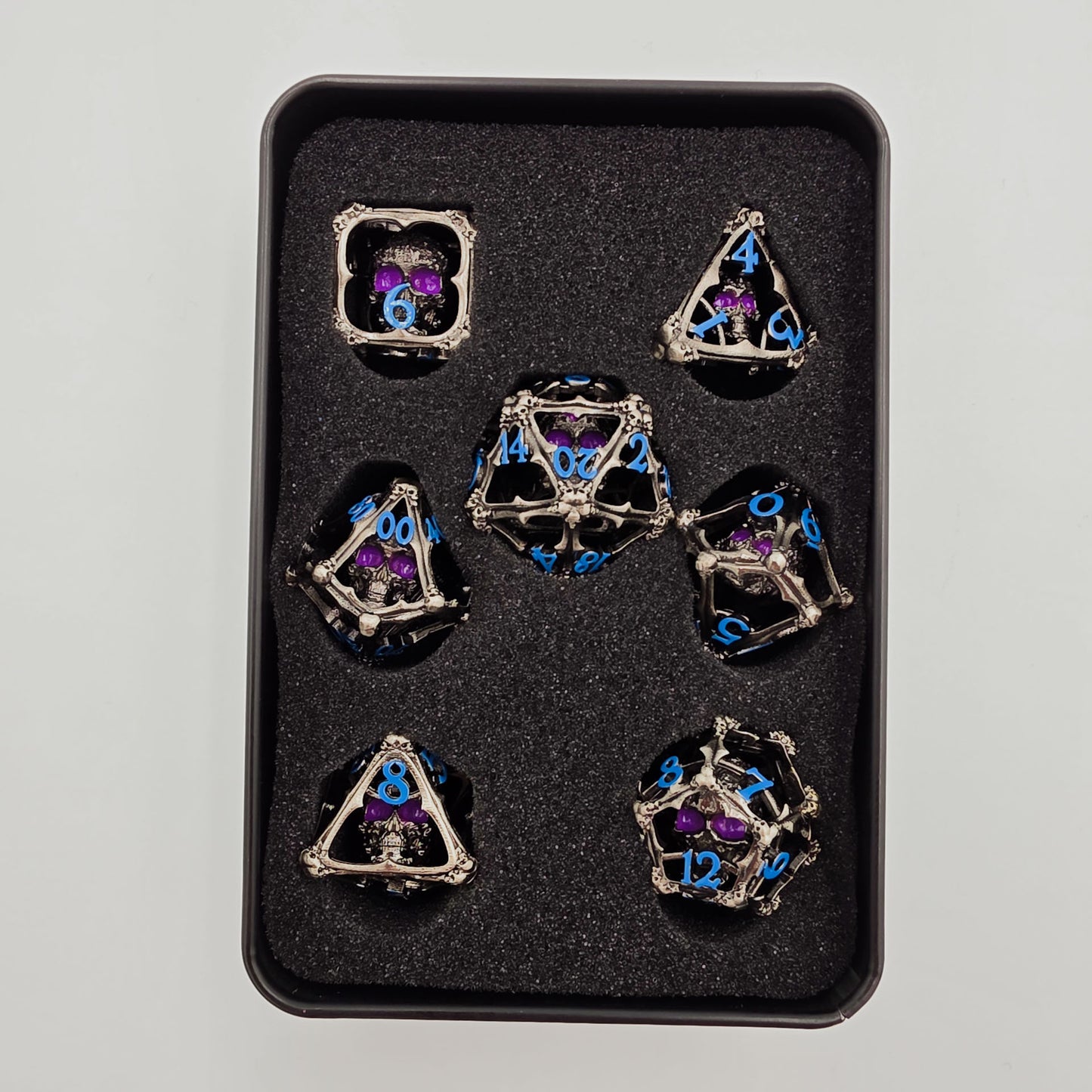 Silver & Blue Hollow Metal 3D Skull DND Dice Set