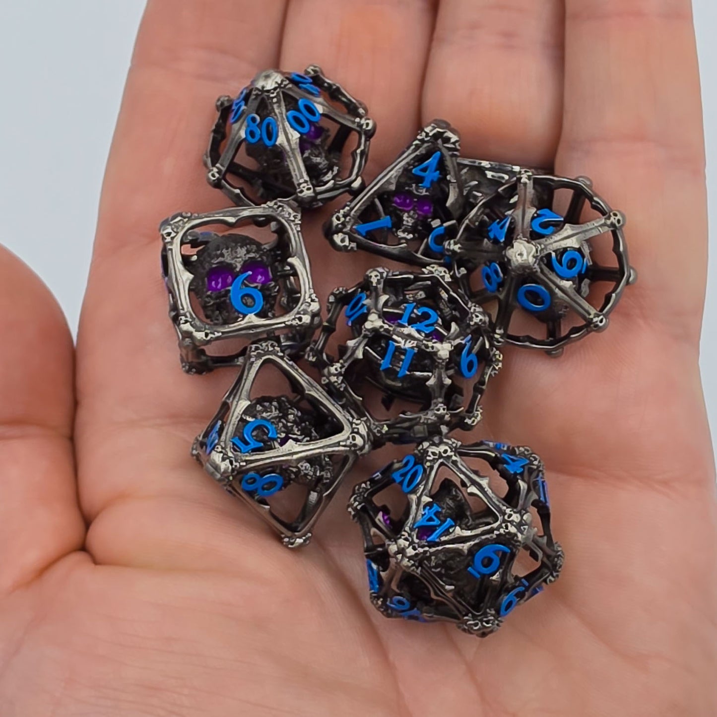 Silver & Blue Hollow Metal 3D Skull DND Dice Set