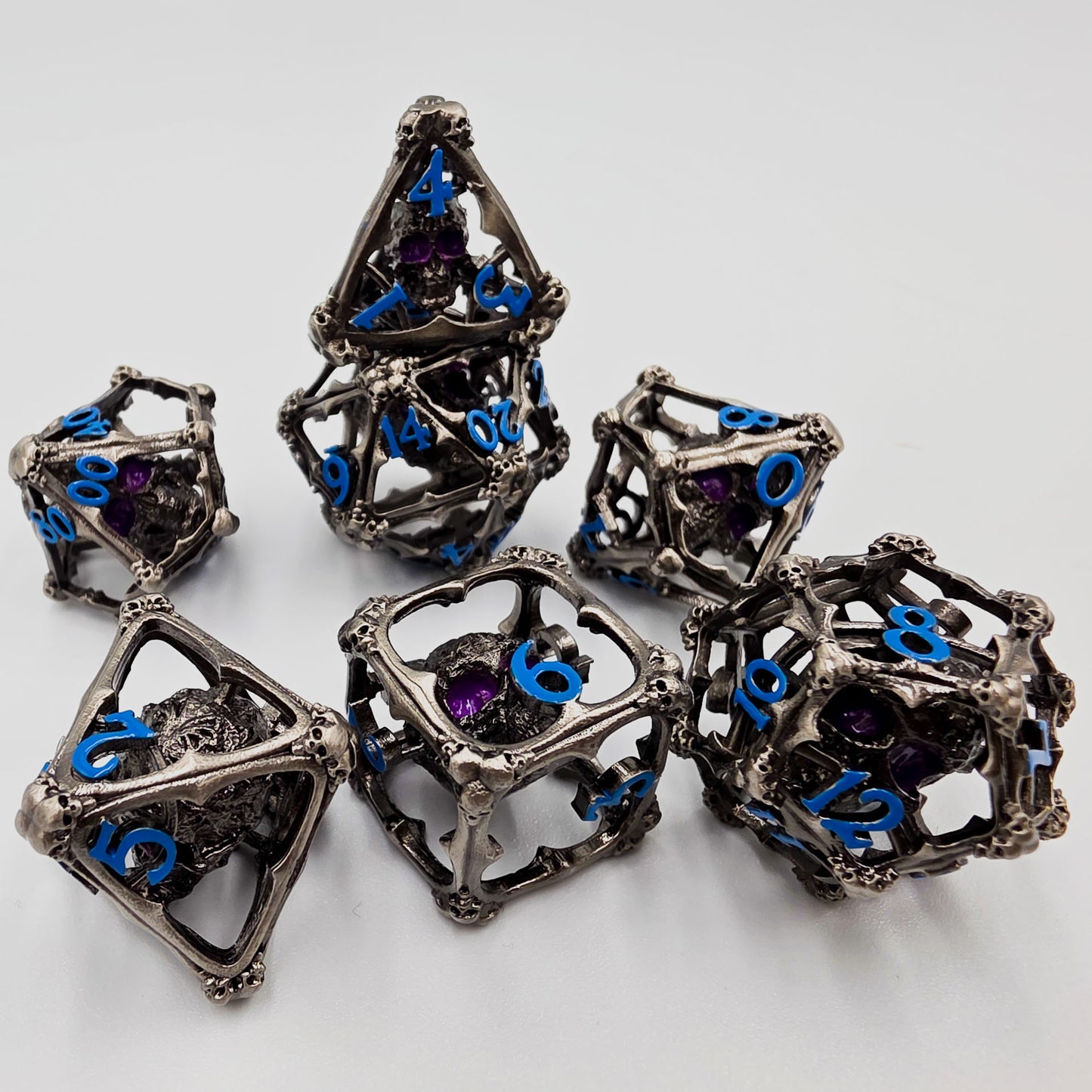 Silver & Blue Hollow Metal 3D Skull DND Dice Set