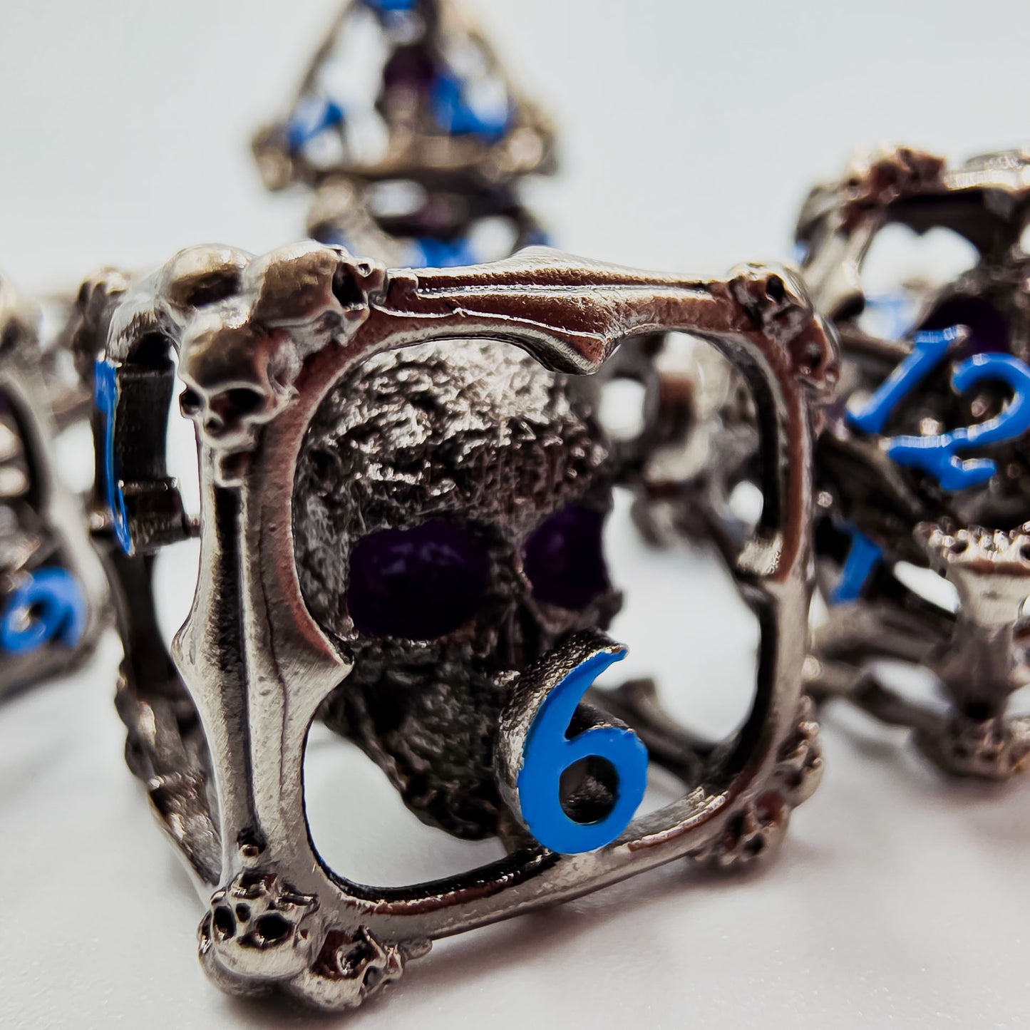 Silver & Blue Hollow Metal 3D Skull DND Dice Set