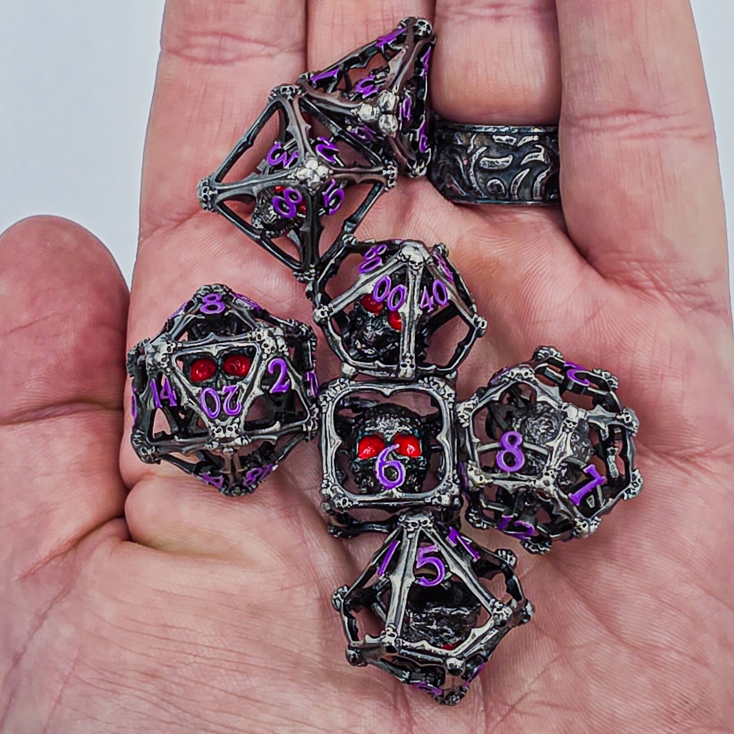 Silver & Purple Hollow Metal 3D Skull DND Dice Set