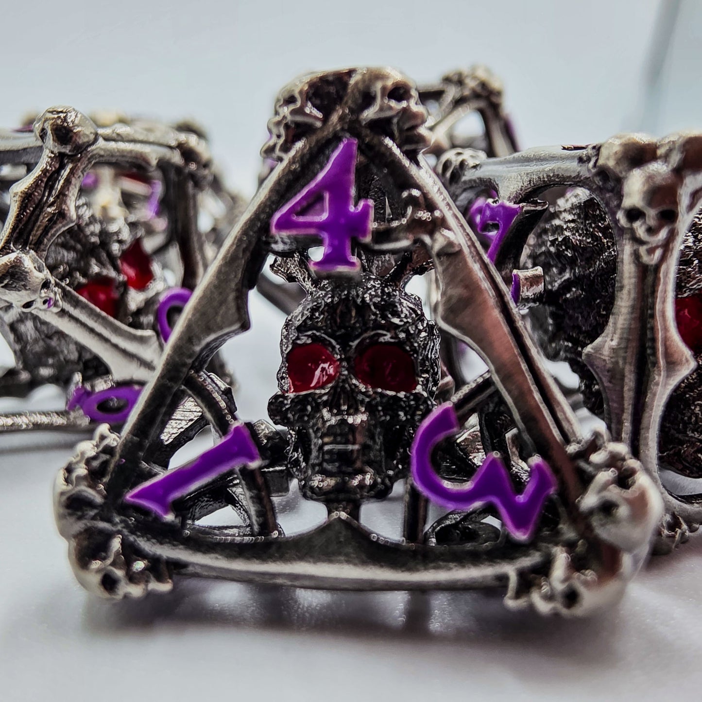 Silver & Purple Hollow Metal 3D Skull DND Dice Set
